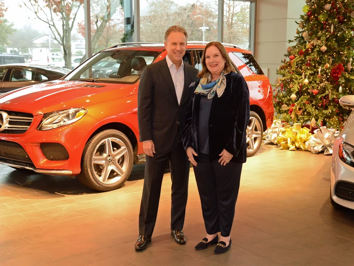 Park Place Motorcars Fort Worth general manager George Johnson with Jewel Charity Ball president Pam Pigman.